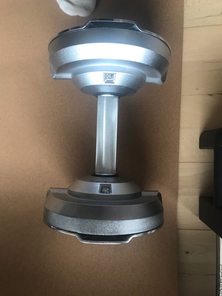 closeup of the braingain adjustable dumbbell plates seated in the cradle